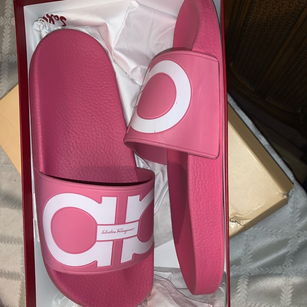 Pink Salvatore Ferragamo slides.